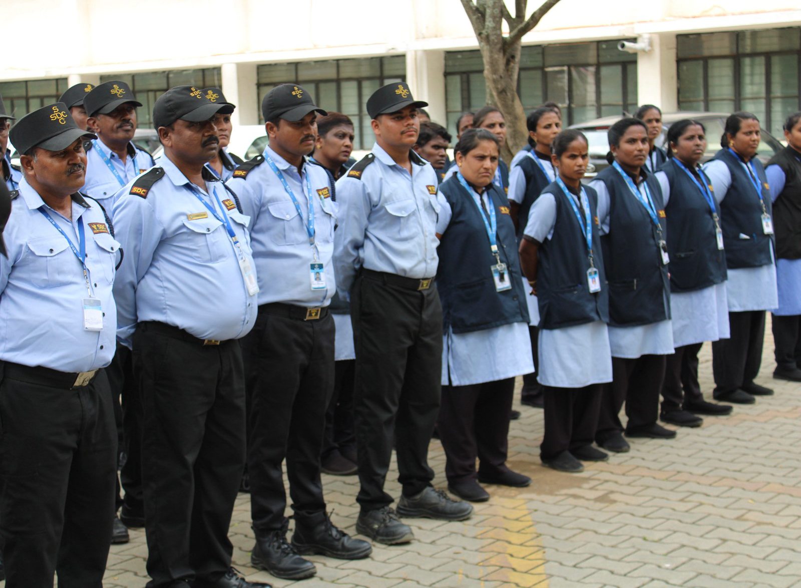 SDC guards and lady guards standing in line in uniform